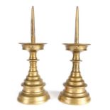 A pair of 16th century brass pricket candlesticks, German or Flemish Each with a long 4.75 inch