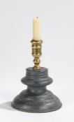 A 17th century part brass socket candlestick and stem later mounted on a painted turned base, 20cm