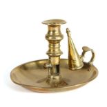A George III cast brass ejector chamberstick With dished pan, fitted with a bulbous candle-socket on