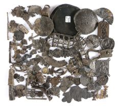 A large collection of Medieval pewter pilgrim's badge fragments, together with a 17th century toy