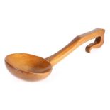 A 19th century fruitwood ladle, Welsh, the long arched handle with a deep wide bowl, 41cm long