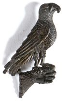 A 14th century pewter secular badge, designed as a falcon  on a falconer's glove, with traces of