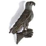 A 14th century pewter secular badge, designed as a falcon  on a falconer's glove, with traces of