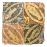 An interesting 14th century floor tile section, French, circa 1300-50, of four tiles set into a