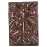 A rare James IV carved oak panel, Scottish, circa 1500, designed with a large stiff single stem,