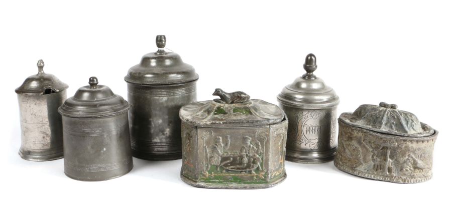 Six 19th century pewter/lead tobacco box and covers Four of circular form, three with an acorn knop,