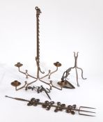 A collection of domestic metalwork, to include an 18th century wrought iron rush light, a