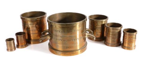 A William IV set of seven brass alloy Imperial Standard measures, Nottingham, each rim marked with