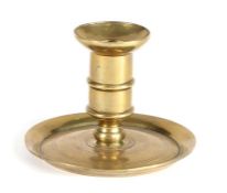 A good George I/II brass ‘lantern’ candlestick, circa 1720-40 The straight sided socket with mid-
