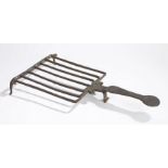 An early to mid-18th century wrought iron hearth trivet or gridiron, Scottish/English, with seven