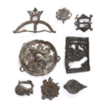 A collection of Medieval  pewter pilgrim and secular badges,  to include: a buckler,  probably