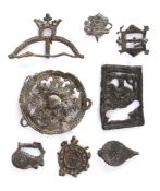A collection of Medieval  pewter pilgrim and secular badges,  to include: a buckler,  probably