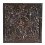 An Elizabeth I carved oak panel, circa 1570, of square form, designed with a central four-petal