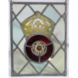 A stained glass panel, designed with a crowned Tudor Rose, 24.5cm wide, 33.5cm high