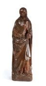 A 15th century carved oak figure, probably Saint Catherine, North European.   With flowing hair,