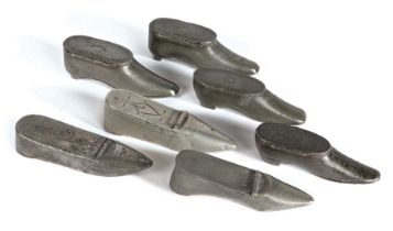 A group of 19th century pewter ‘shoe’ snuff boxes All with decoration (7) Some surface scratches,