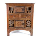 An oak livery cupboard, in the English circa 1500 manner, incorporating period elements, the front