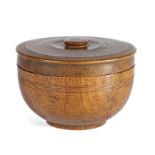 A 19th century treen spice pot and cover, the lathe turned pot with ring decoration and fitted lid
