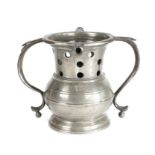 AN EXTREMELY RARE VICTORIAN PEWTER PUZZLE-JUG, PROBABLY BRISTOL, CIRCA 1850 The flared neck with