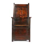An early 18th century oak and fruitwood box-seat armchair, English/Welsh, circa 1700-30, with