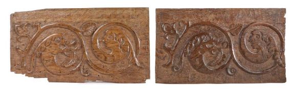 Two Elizabeth I carved oak panels, circa 1570, each designed with leafy-scrolls terminating in