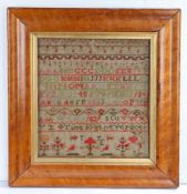 A George IV  needlework sampler, by Ann Wyles 1829, with alphabets and numbers above a short line