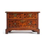 An attractive marquetry-inlaid table chest, the rectangular top above two short and one long