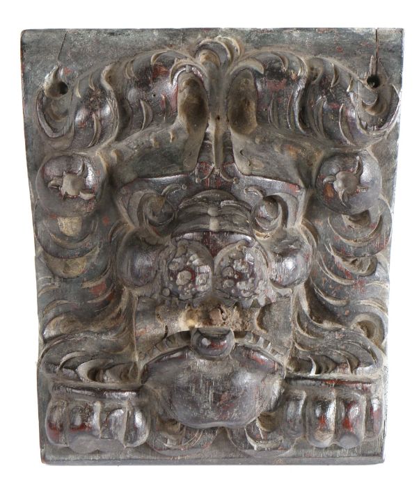 A  carved oak lion corbel, circa 1600-20 with a curled mane and open mouth with 'tongue',  above