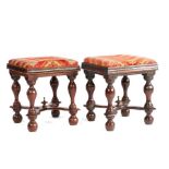 A rare pair of William and Mary yew wood stools, circa 1690 , each with a drop-in padded seat,