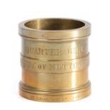 A George V brass alloy Imperial Standard measure, the rim marked with the Exchequer portcullis and