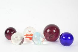 Six art glass paperweights, to include Caithness 'Silver Rain', 'Isle of Wight Glass', a Bristol