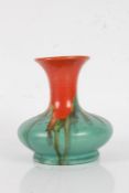 Belgian pottery vase, of squat baluster form, with orange and green running glaze, 16cm tall