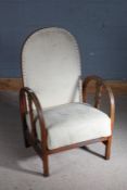 Mid 20th century oak framed adjustable fire side chair, with arched back and elbow rests, 89cm high