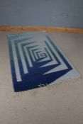 Mid 20th Century carpet, the grey ground with blue gradient patterning and tasselled ends, 182cm x