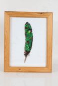 Jovel (Contemporary), a painted bird feather, signed and dated 99 to the centre, mounted in a glazed