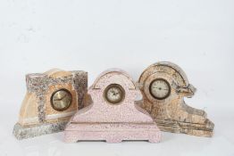 Three various pottery lustre glazed mantle clocks, one in pink, the others in orange (3)