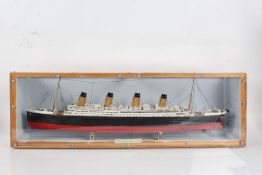 H.M.S. Titanic, painted model housed within a perspex and wooden case, the case 85cm long
