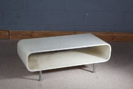 White coffee table/ media unit, the oval open top section  raised on chrome legs, 100.5cm wide