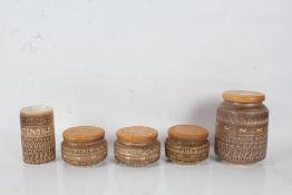 Four Bristow's pottery storage jars, and matching utensil pot (5)