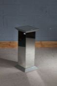 Mirrored pedestal, raised on a stepped base, 28.5cm square, 68.5cm high
