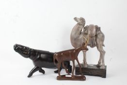 African carved ebony hippopotamus, 36cm long, together with a grey painted camel, and an antelope (
