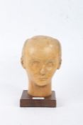 Francis Latham (1908-1994), carved limewood bust, in the form of a gentleman, raised on square base,