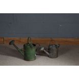 Two galvanised watering cans, one painted in green (2)
