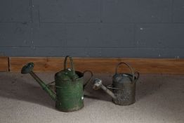 Two galvanised watering cans, one painted in green (2)