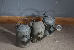 Three galvanised watering cans (3)