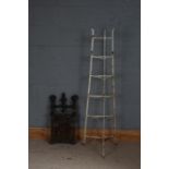 White painted metal pot stand, together with a cast iron pierced panel (2)