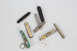 Eight various penknives, to include Welsh Lady, Mahle-Kolben, and Champagne Reims etc., (8)