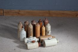 Collection of stoneware bottles and foot warmers (qty)