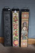 Three metal hanging plaques, one inset with a cast metal panel of an urn of flowers, the others with