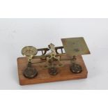 Set of postage scales with the prices of assicated weight engraved to the base, made by S.